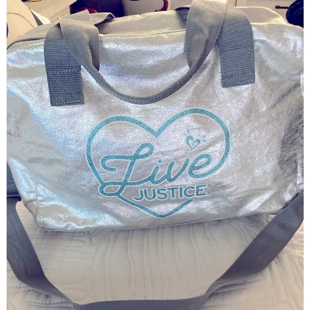 Justice metallic silver duffle like new!
